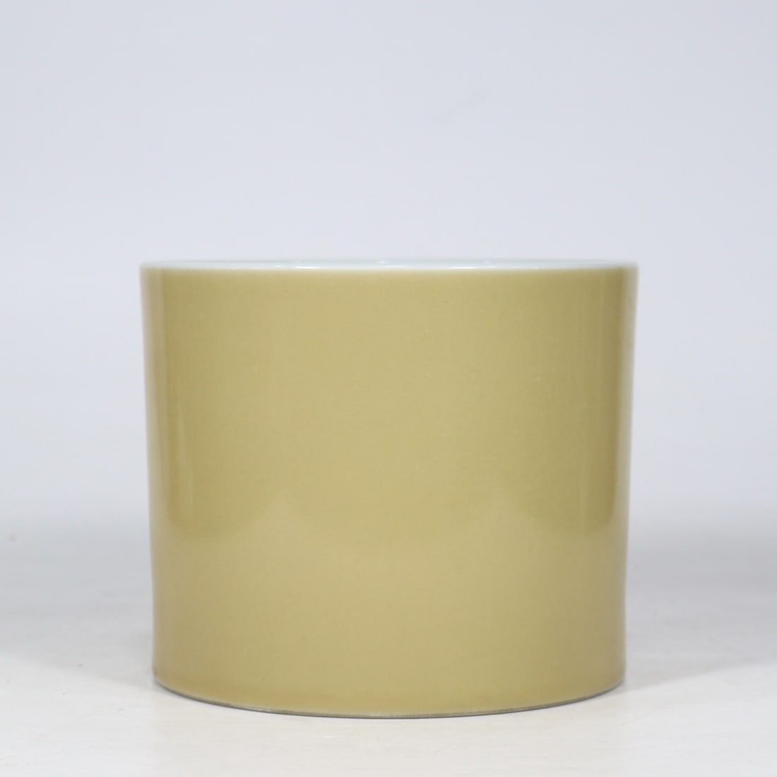 An Exquisite Yellow Glazed Brush Pot: An Exquisite Yellow Glazed Brush Pot Qing Dynasty, China Yongzheng Six-character Mark Size:5.8inx7in米黄釉笔筒 中国清代