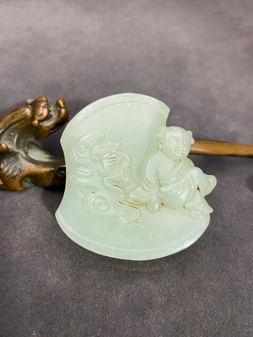 An Exquisite White Jade Figure Pattern Pendant: An Exquisite White Jade Figure Pattern Pendant Qing Dynasty, China Size:52.6mmx52.8mmx12mm Weight:60g白玉平步青云童子挂件