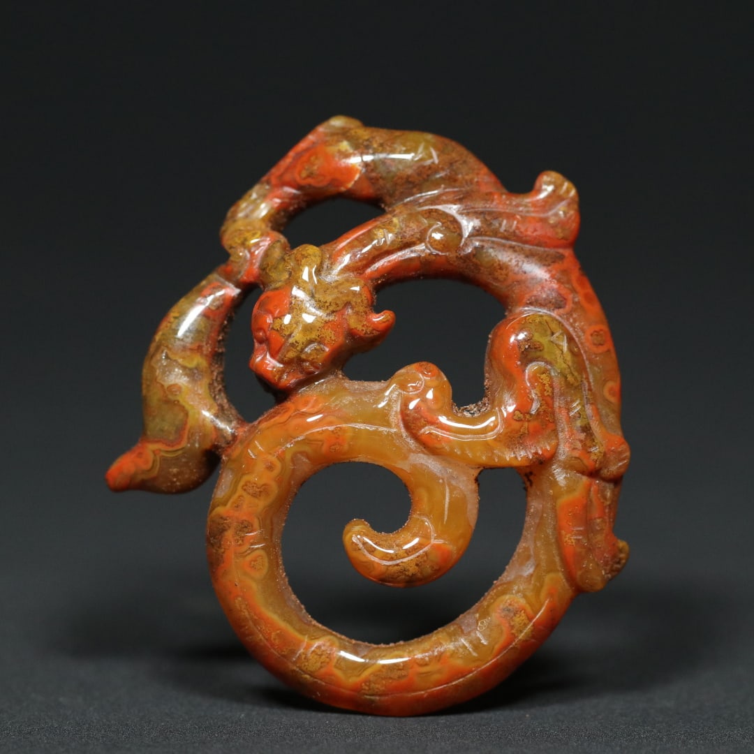 An Exquisite Agate Chi-Dragon Pendant: An Exquisite Agate Chi-Dragon Pendant Han Dynasty, China Size:2.5inx2.2inx0.6in Weight:32.7g玛瑙螭龙佩挂件 中国汉代
