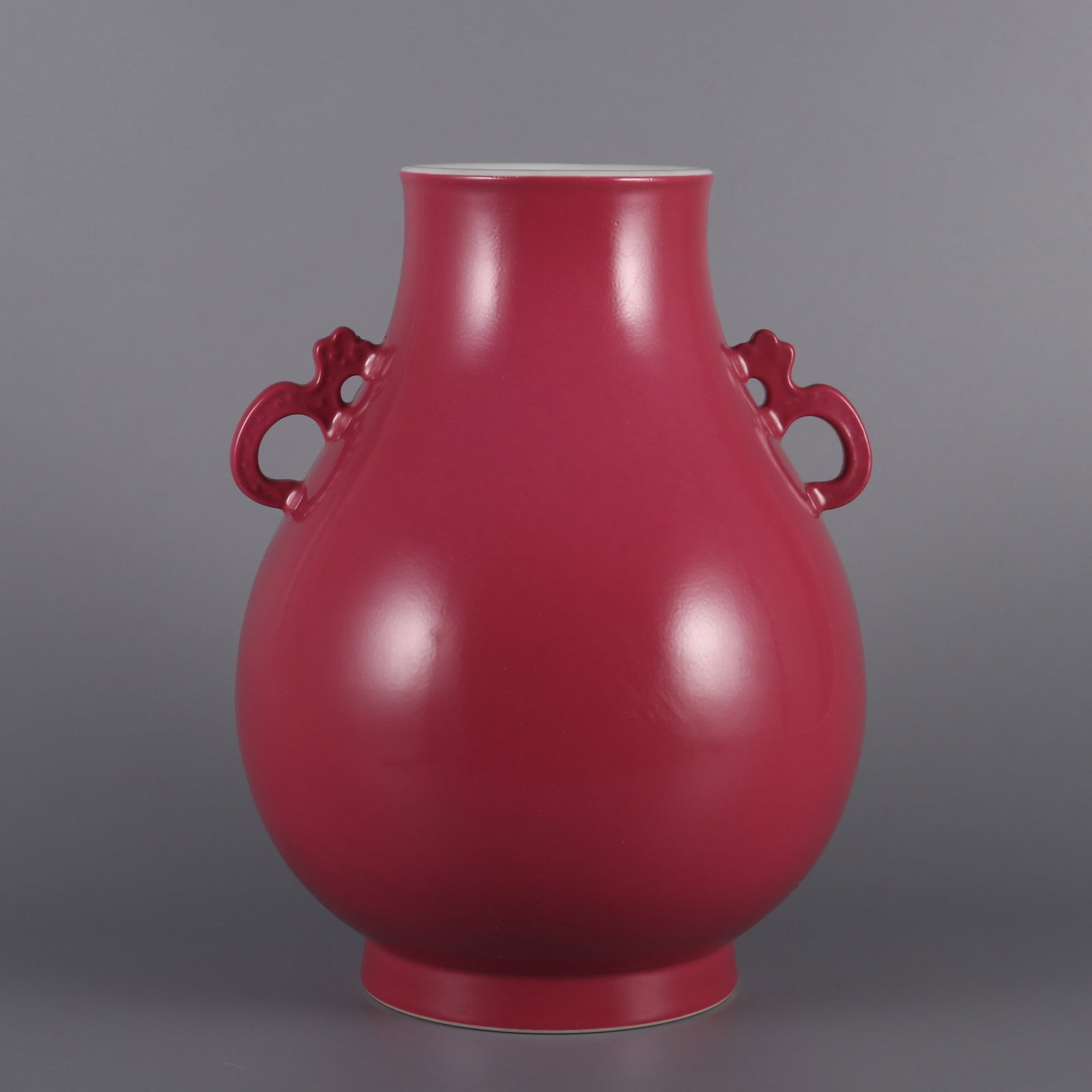 An Exquisite Ruby Red-Glazed Double-Ears Vase: An Exquisite Ruby Red-Glazed Double-Ears Vase Qing Dynasty, China Qianlong Six-character Mark Size:10.2inx7.5in胭脂红釉如意耳尊瓶