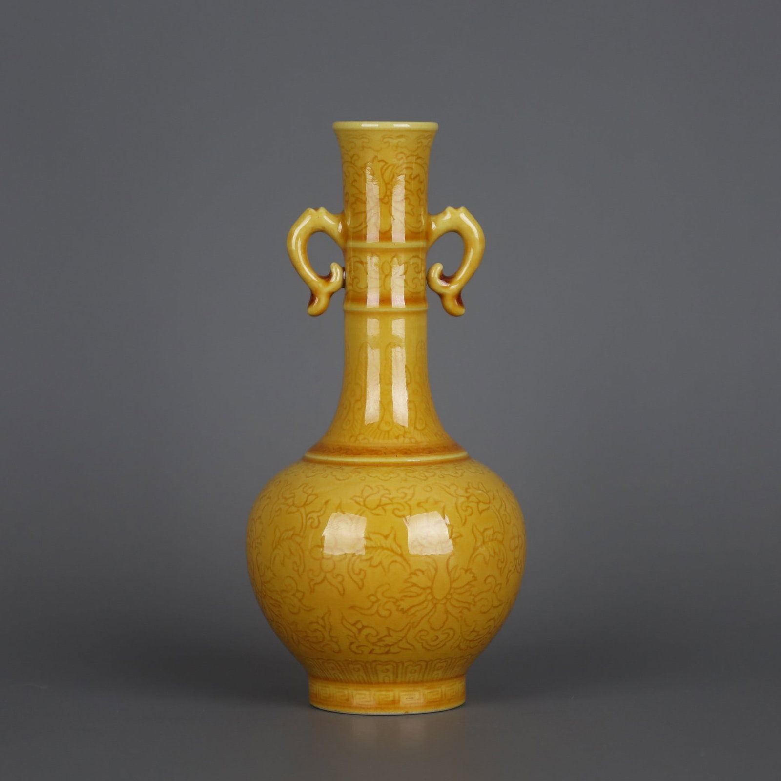 A Exquisite Yellow Glazed Lotus Pattern Double-Ears Vase: A Exquisite Yellow Glazed Lotus Pattern Double-Ears Vase,Qing Dynasty, China,Daoguang Six-character Mark,Size:4.8inx2.2in