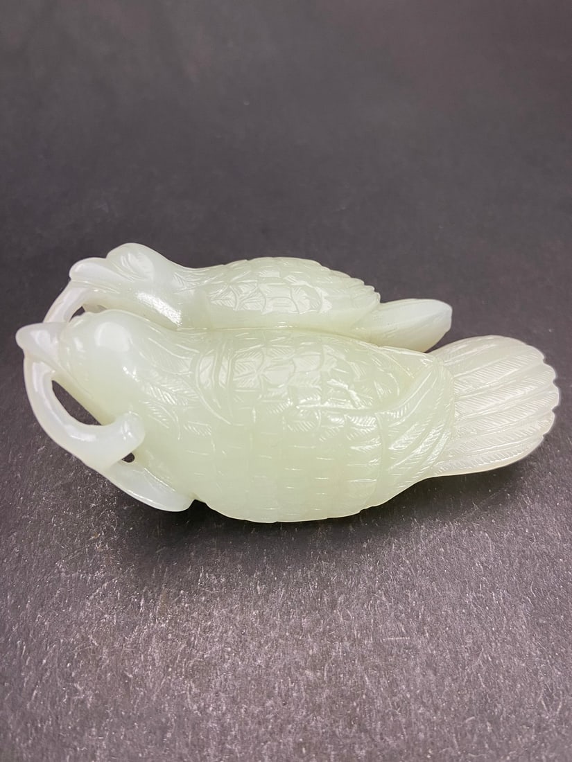 A Exquisite Hotan Jade Bird Handheld Carving: A Exquisite Hotan Jade Bird Handheld Carving,Ming Dynasty, China,Size:3.4inx1.6inx1.4in ,Weight:135g 和田玉鸟手把件,中国明代