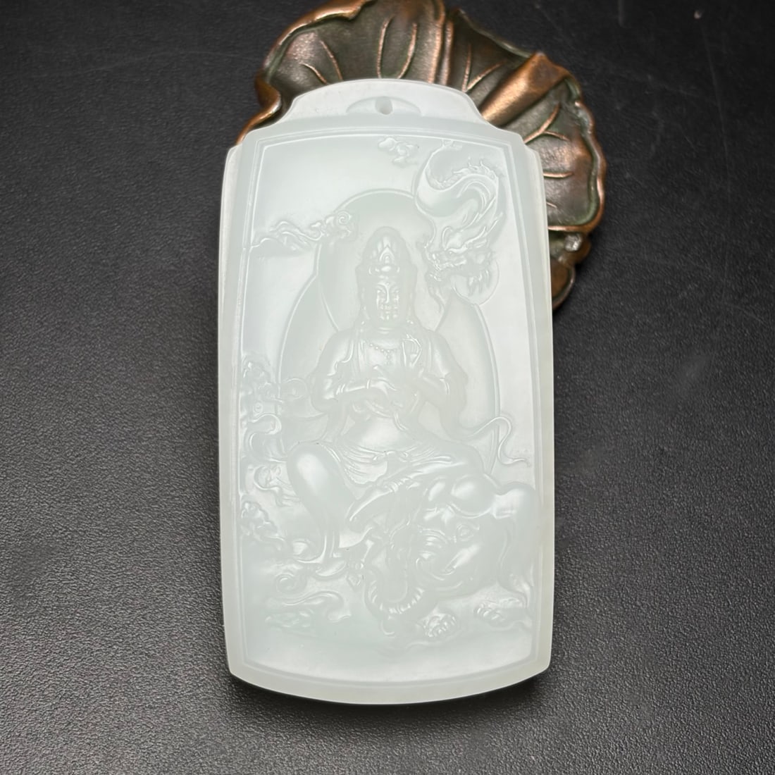 A Exquisite Hotan Jade Avalokitesvara Brand: A Exquisite Hotan Jade Avalokitesvara Brand,Qing Dynasty, China,Size:2.8inx1.5inx0.4in, Weight:63g 和田玉观音牌,中国清代