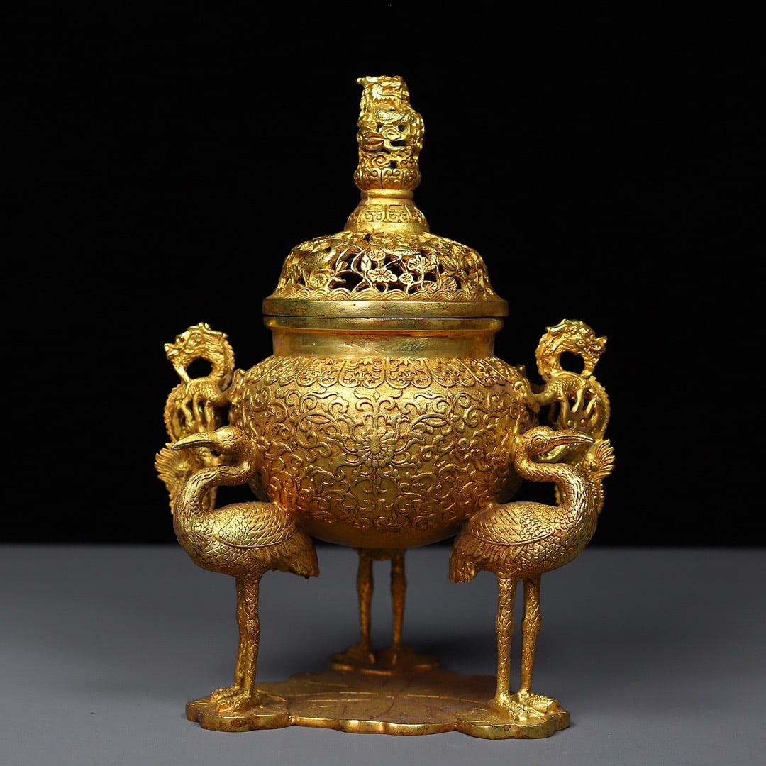 A Exquisite Gilt Bronze Double-Ears Crane-legs Censer: A Exquisite Gilt Bronze Double-Ears Crane-legs Censer,Ming Dynasty, China,Xuande Six-character Mark,Size:6.3inx9.8in,Weight:1739g 铜鎏金双耳鹤足炉,È