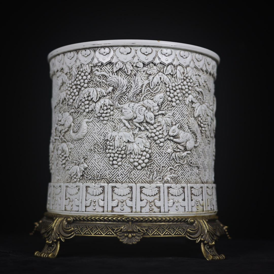 A Exquisite White Glaze Inlaid Copper Squirrel and Grapes Pattern Brush Pot: A Exquisite White Glaze Inlaid Copper Squirrel and Grapes Pattern Brush Pot,Qing Dynasty, China,With Mark,Size:9.8inx8.9inx10.2in 白釉镶铜松鼠葡萄ಬ