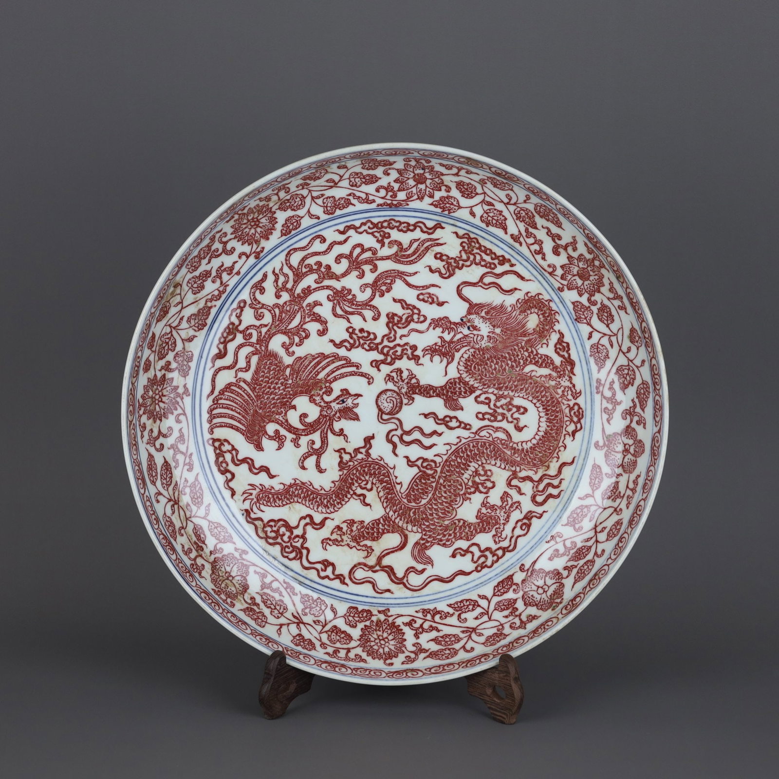 A Exquisite Underglaze-Red Dragon and Phoenix Pattern Plate: A Exquisite Underglaze-Red Dragon and Phoenix Pattern Plate,Qing Dynasty, China,Qianlong Six-character Mark,Size:2.4inx12.7in 釉里红龙凤纹盘,中国&