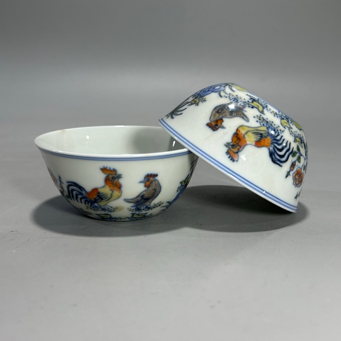 A pair of Exquisite Doucai Fowl Pattern Cup: A pair of Exquisite Doucai Fowl Pattern Cup,Qing Dynasty, China,Yongzheng Six-character Mark,Size:3.3inx1.6in