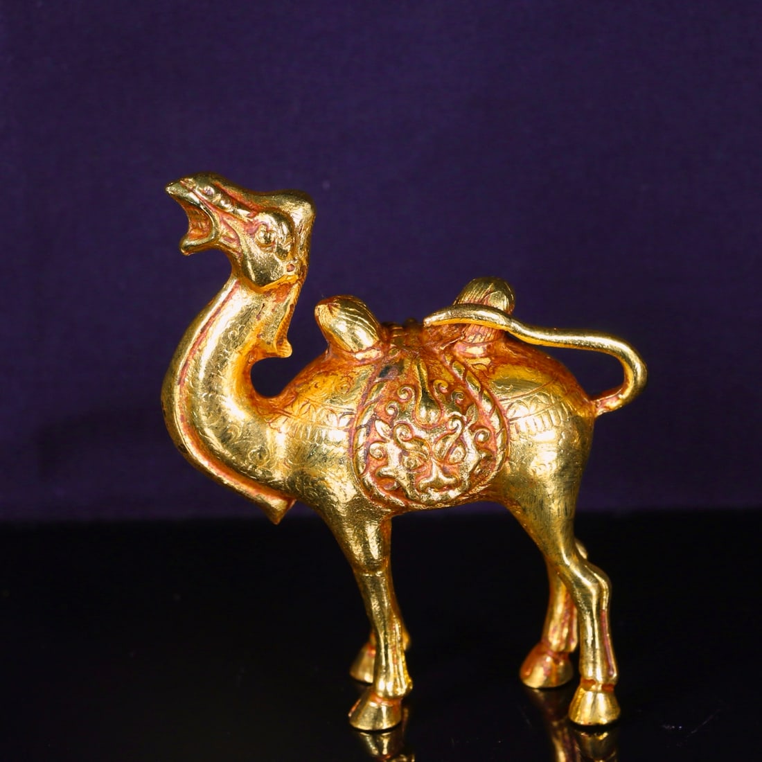 A Exquisite Gilt Bronze Camel Ornament: A Exquisite Gilt Bronze Camel Ornament,Tang Dynasty, China,Size:3.5inx4.1in,Weight:530g 铜鎏金骆驼摆件,中国唐代