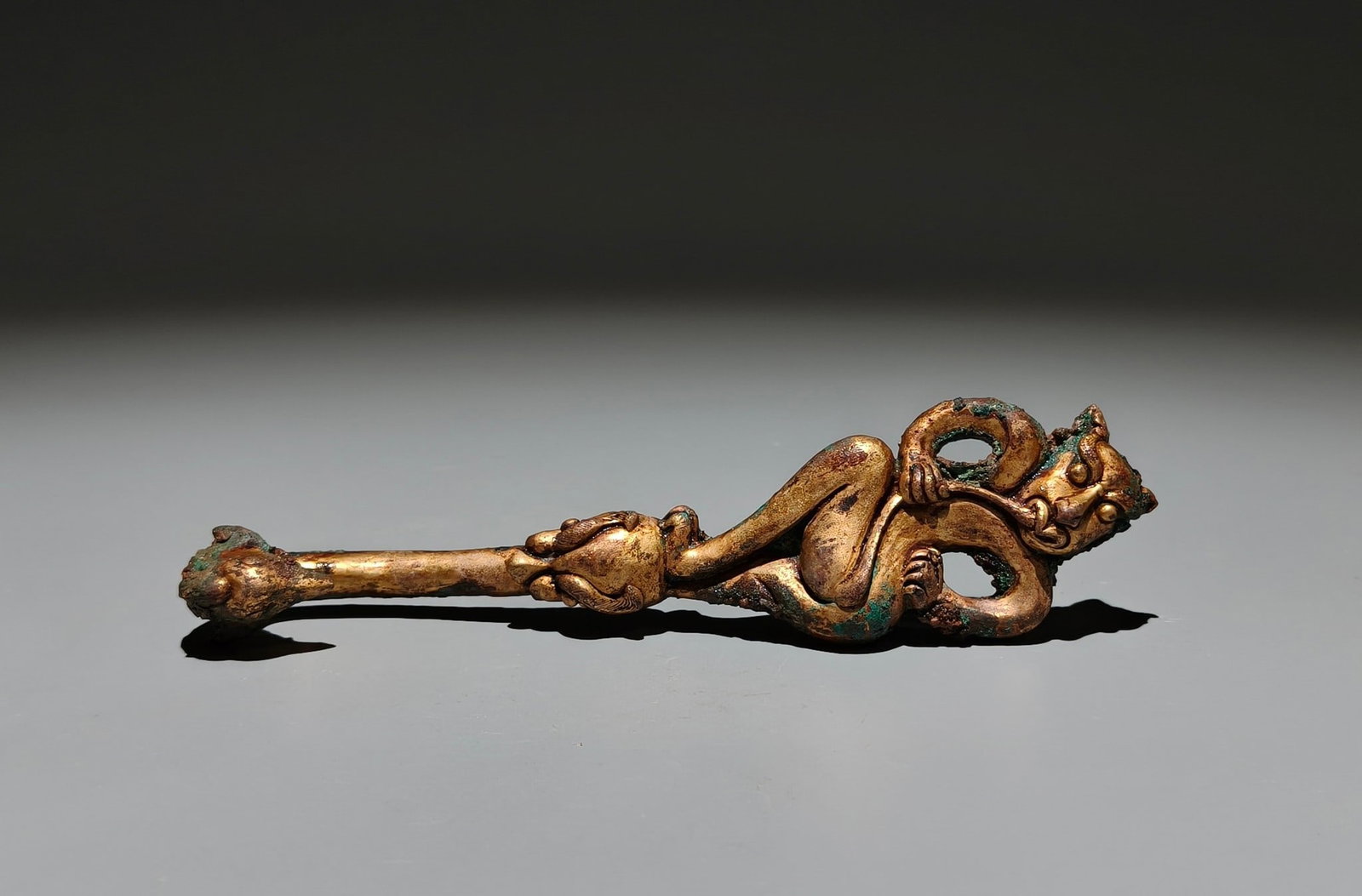 A Exquisite Gilt Bronze Beast-Face Pattern Handheld Carving: A Exquisite Gilt Bronze Beast-Face Pattern Handheld Carving,Han Dynasty, China,Size:5.9inx1.4in 铜鎏金兽面纹手把件,中国汉代