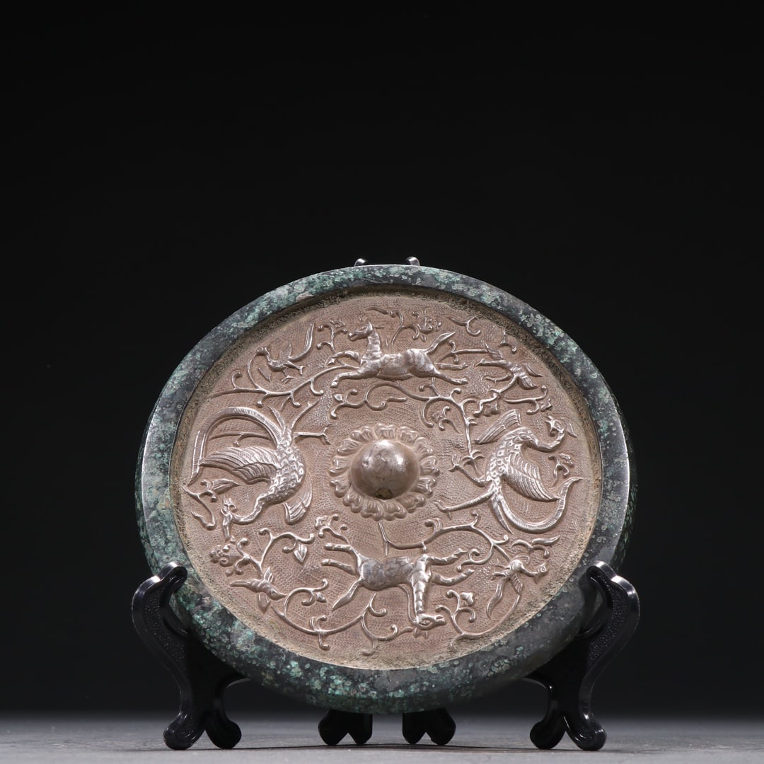 A Exquisite Bronze Inlaid Silver Auspicious Beast Pattern Mirror: A Exquisite Bronze Inlaid Silver Auspicious Beast Pattern Mirror,Tang Dynasty, China,Size:5.7in,Weight:460g 青铜嵌银瑞兽纹铜镜,中国