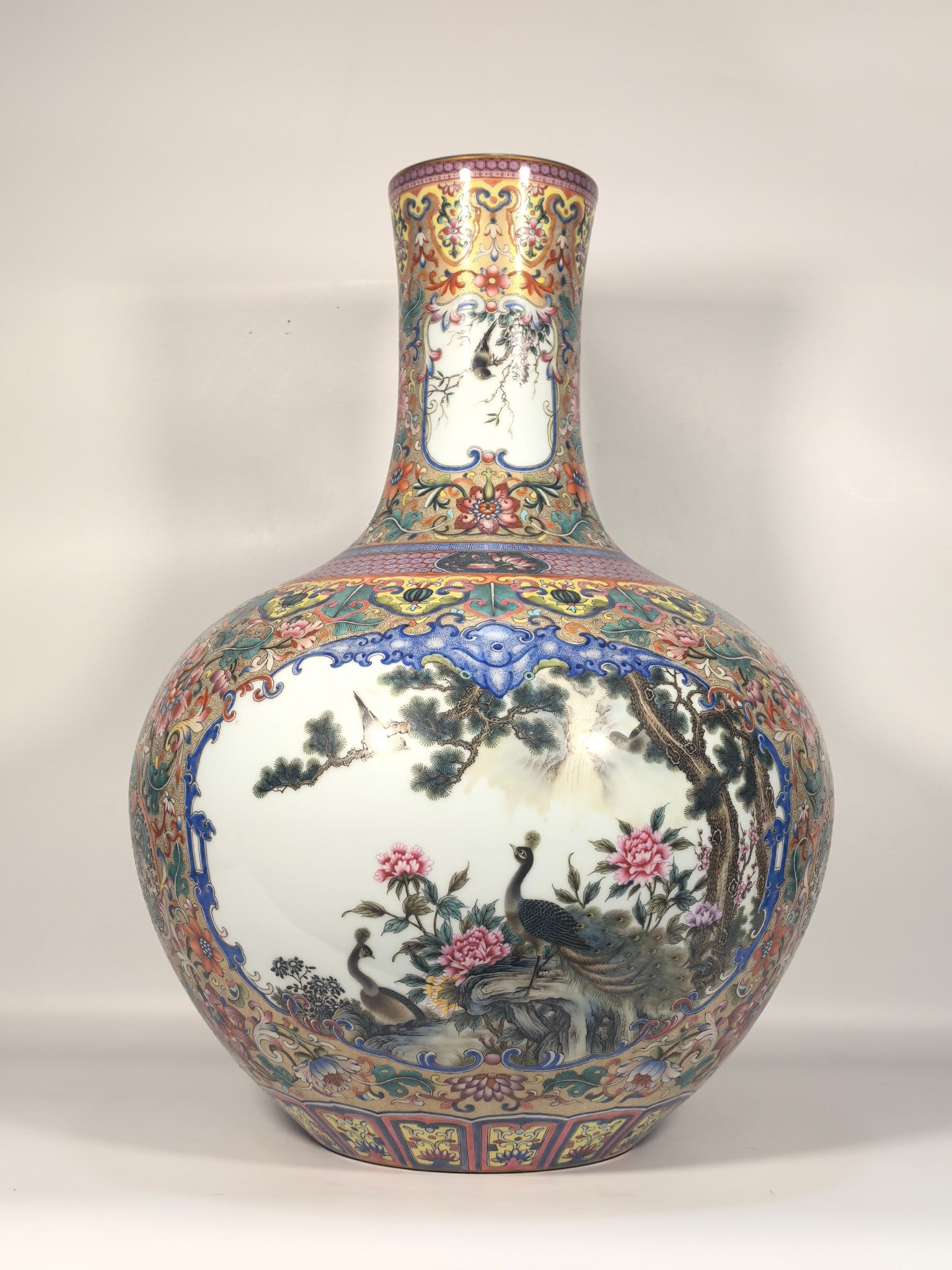 A Exquisite Famille-Rose Flower and Bird Pattern Vase: A Exquisite Famille-Rose Flower and Bird Pattern Vase,Qing Dynasty, China,Qianlong Six-character Mark,Size:21.3inx4.7inx15inx6.9in