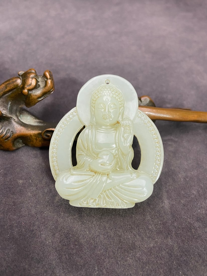 A Exquisite Hotan Jade Buddha Pendant: A Exquisite Hotan Jade Buddha Pendant,Ming Dynasty, China,Size:1.9inx1.7inx0.5in ,Weight:35g 和田玉佛吊坠,中国明代