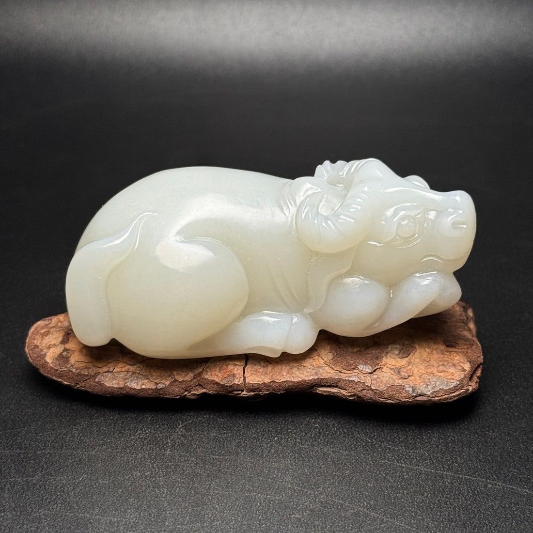 A Exquisite Hotan Jade Buffalo Handheld Carving: A Exquisite Hotan Jade Buffalo Handheld Carving,Qing Dynasty, China,Size:3.2inx1.8inx1.3in ,Weight:168g 和田玉牛手把件,中国清代
