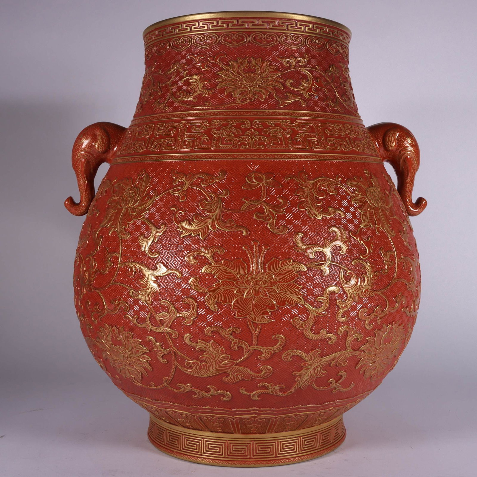 A Exquisite Iron-Red Carved Painted Gold Lotus Pattern Elephant-Ears Vase: A Exquisite Iron-Red Carved Painted Gold Lotus Pattern Elephant-Ears Vase,Qing Dynasty, China,Qianlong Six-character Mark,Size:12.2inx9.4in 矾红雕刻描金缠