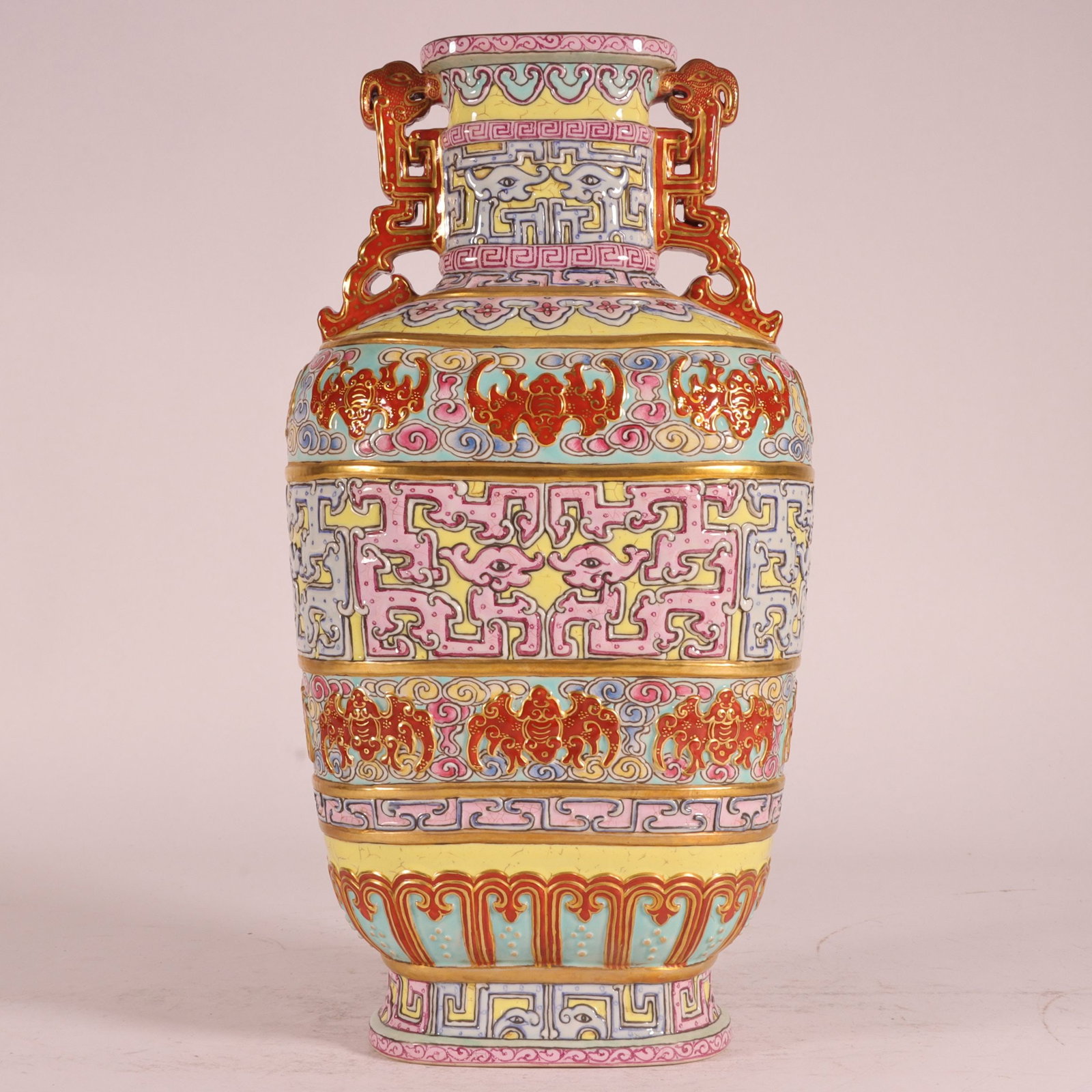 A Exquisite Enamel Carved Yellow Ground Painted Gold Bats Pattern Double-Ears Vase: A Exquisite Enamel Carved Yellow Ground Painted Gold Bats Pattern Double-Ears Vase,Qing Dynasty, China,Qianlong Six-character Mark,Size:9.6inx4.9in 珐琅彩雕刻黄