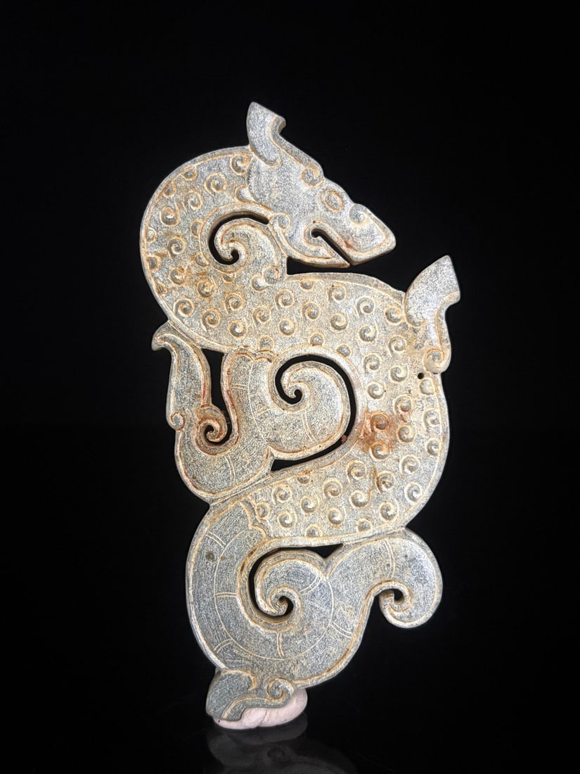 An Exquisite White Jade Dragon Ornament: An Exquisite White Jade Dragon Ornament Han Dynasty, China Size:5.2inx2.6inx0.2in Weight:78g白玉谷纹s龙佩 中国汉代 Size:13.2cmx6.6cmx0.5cm W