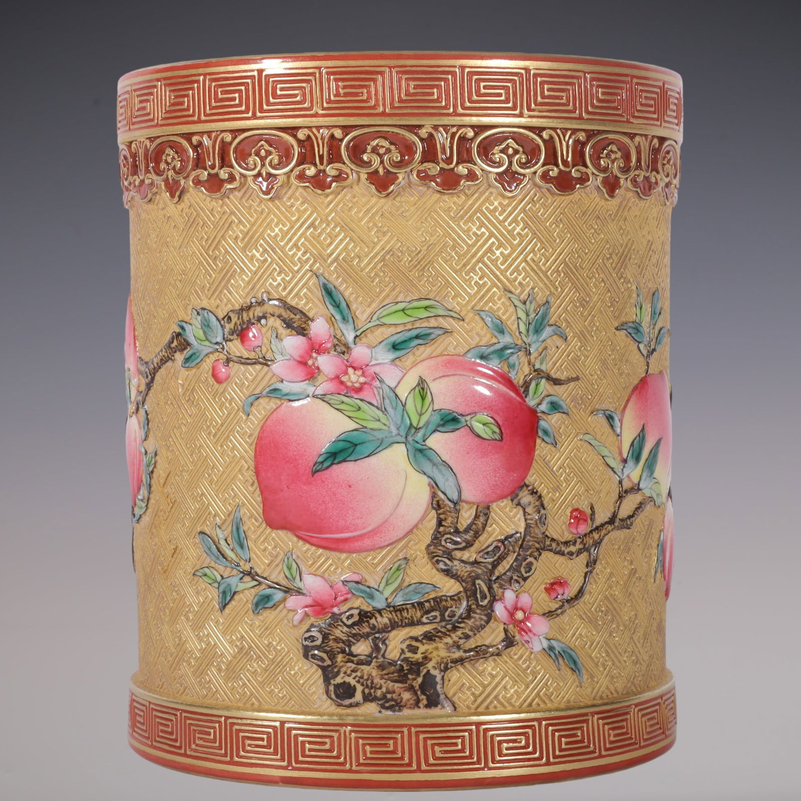 An Exquisite Enamel Peach Pattern Brush Pot: An Exquisite Enamel Peach Pattern Brush Pot Qing Dynasty, China Qianlong Six-character Mark Size:5.6inx4.7in珐琅彩雕刻金地寿桃笔筒 