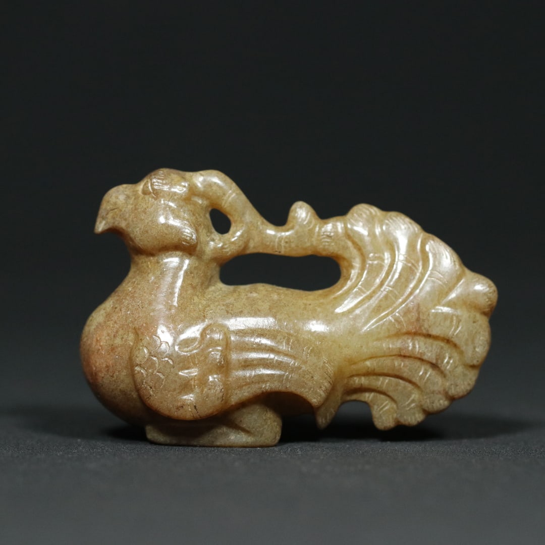 An Exquisite White Jade Phoenix Pendant: An Exquisite White Jade Phoenix Pendant Han Dynasty, China Size:2.3inx1inx1.5in Weight:50.5g白玉凤鸟挂件 中国汉代 Size:5.8cmx2.5cmx3.8cm Wei