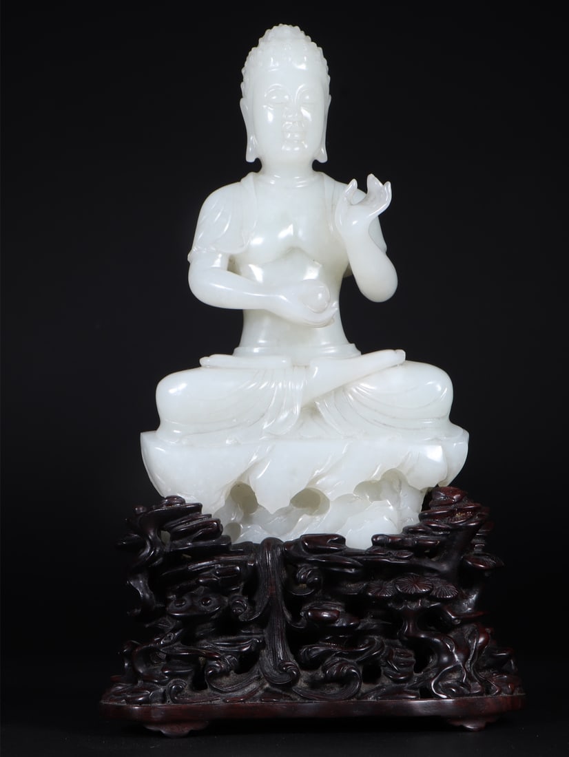 An Exquisite White Jade Statue of Sakyamuni: An Exquisite White Jade Statue of Sakyamuni Qing Dynasty, China Size:4.4inx2.6inx7.5in Weight:1144g白玉释伽牟尼佛坐像 中国清