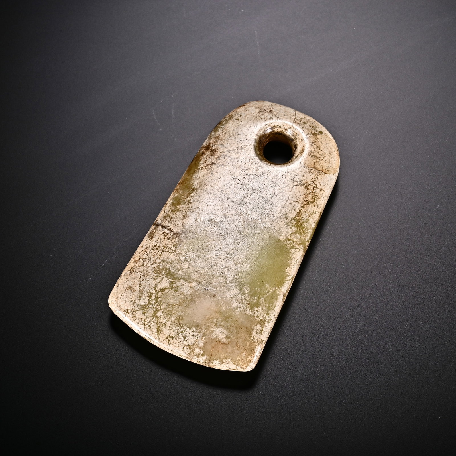 An Exquisite White Jade Pendant: An Exquisite White Jade Pendant Han Dynasty, China Size:2.8inx1.5in Weight:48g白玉挂件 中国汉代 Size:7.1cmx3.9cm Weight:48g