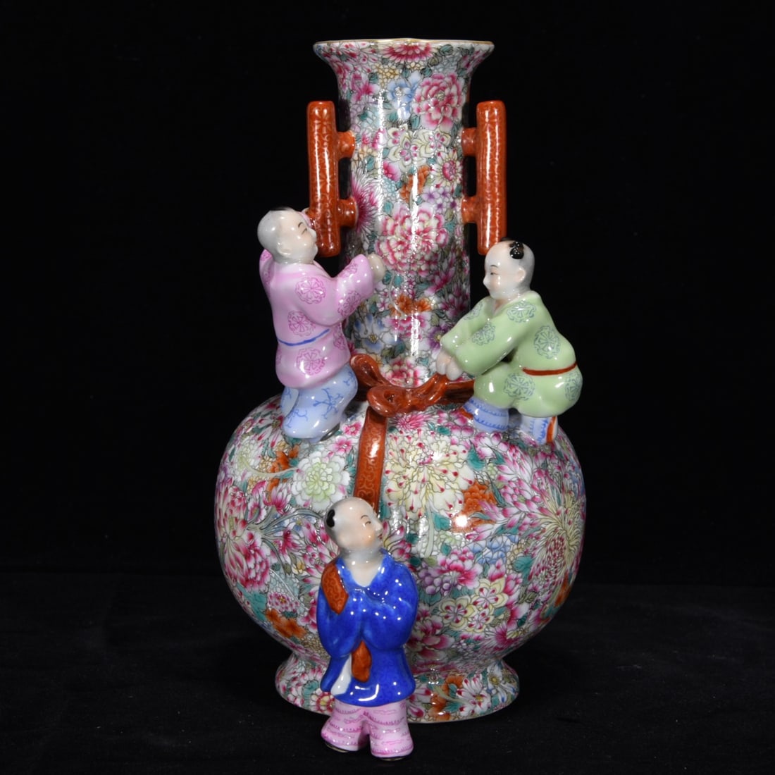 An Exquisite Famille-Rose Flower Pattern Vase: An Exquisite Famille-Rose Flower Pattern Vase Qing Dynasty, China Qianlong Six-character Mark Size:8.3inx5.9in粉彩万花童子纹三耳瓶 中&