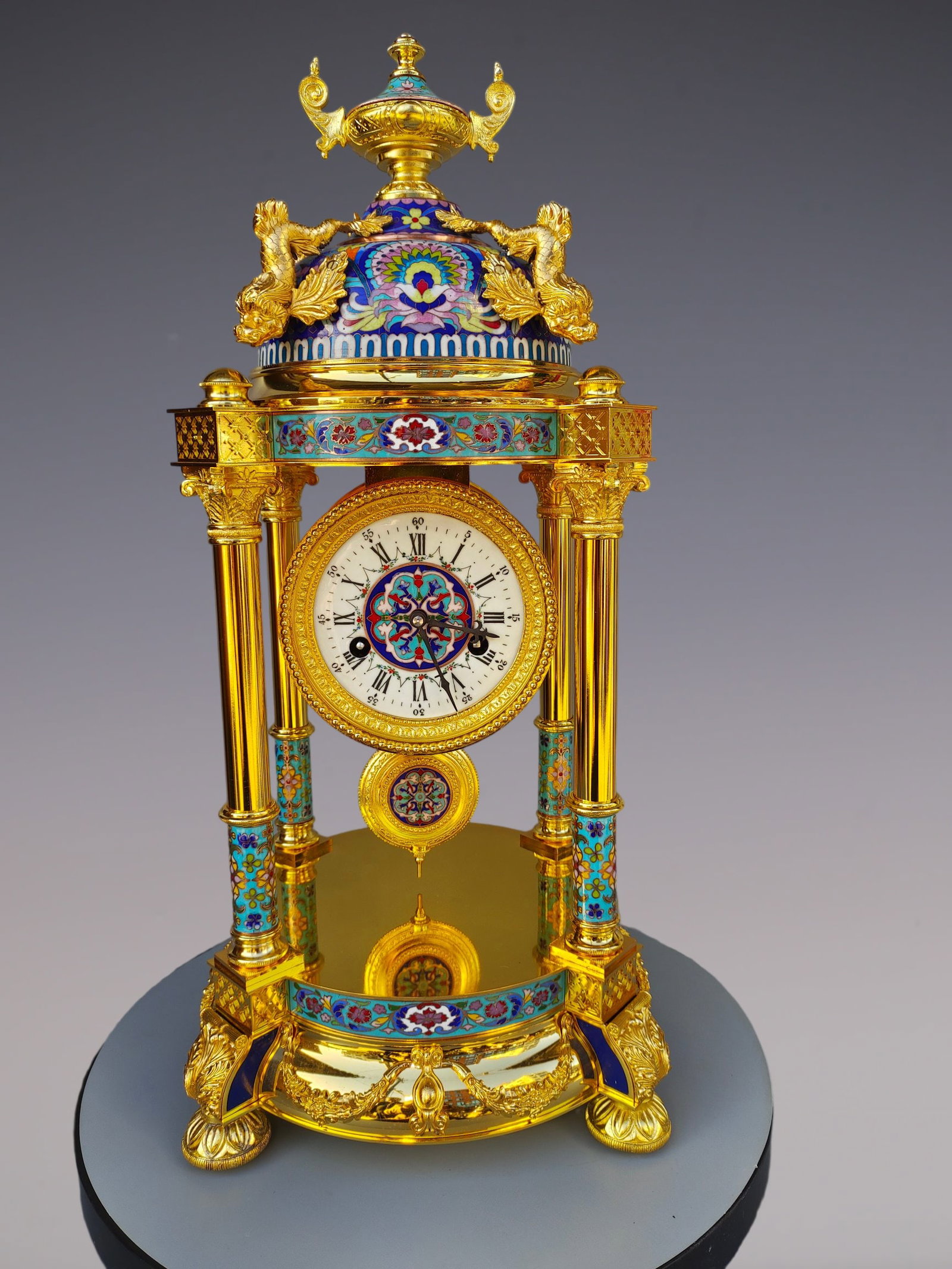 An Exquisite Gilt Bronze Lotus Pattern Clock: An Exquisite Gilt Bronze Lotus Pattern Clock Size:11.8inx11.8inx24.4in铜鎏金缠枝莲纹钟表 Size:30cmx30cmx62cm