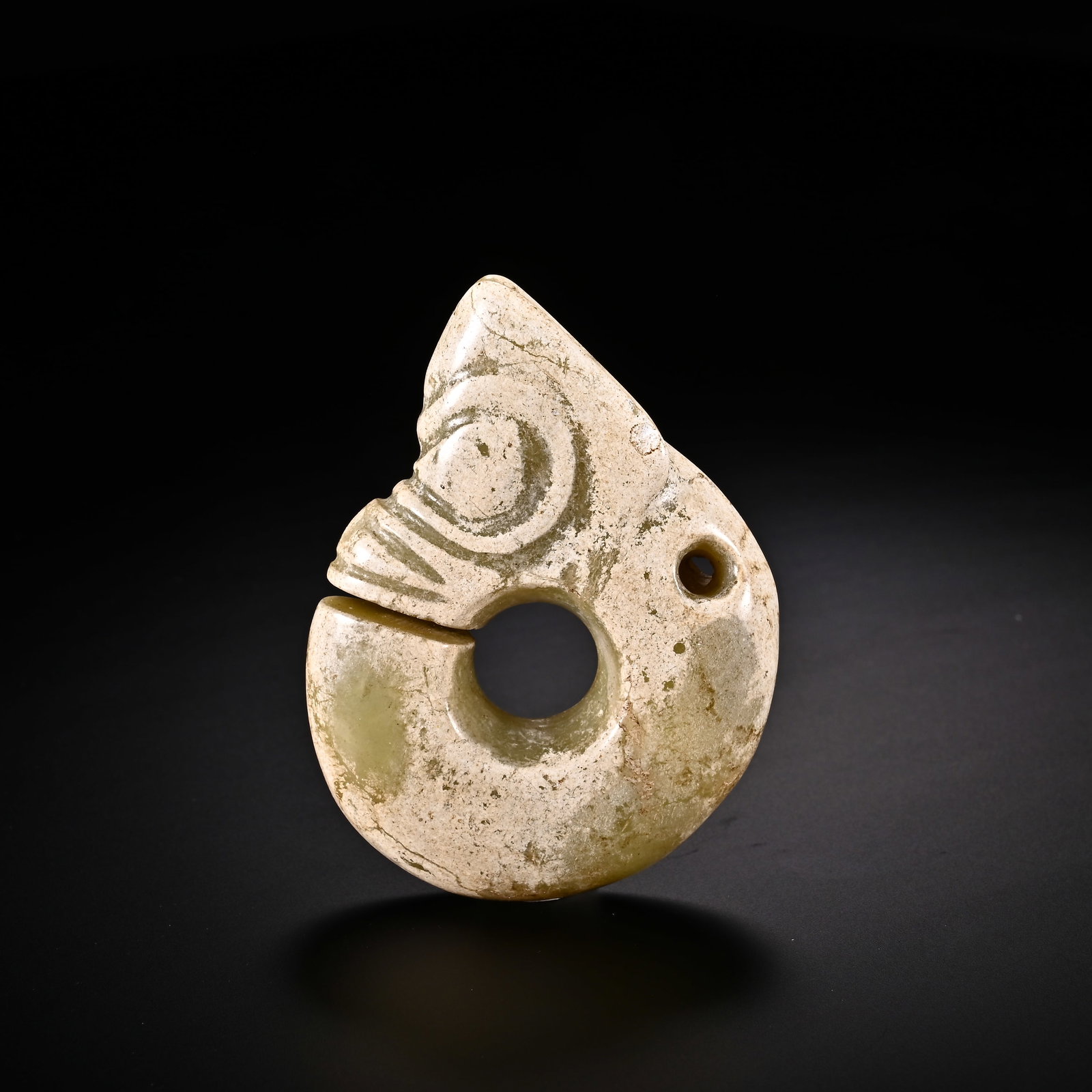An Exquisite White Jade 'Boar& Dragon' Pendant: An Exquisite White Jade 'Boar& Dragon' Pendant Han Dynasty, China Size:2.5inx1.9in Weight:58g白玉猪龙挂件 中国汉代 Size:6.4cmx4.7cm Weight:5