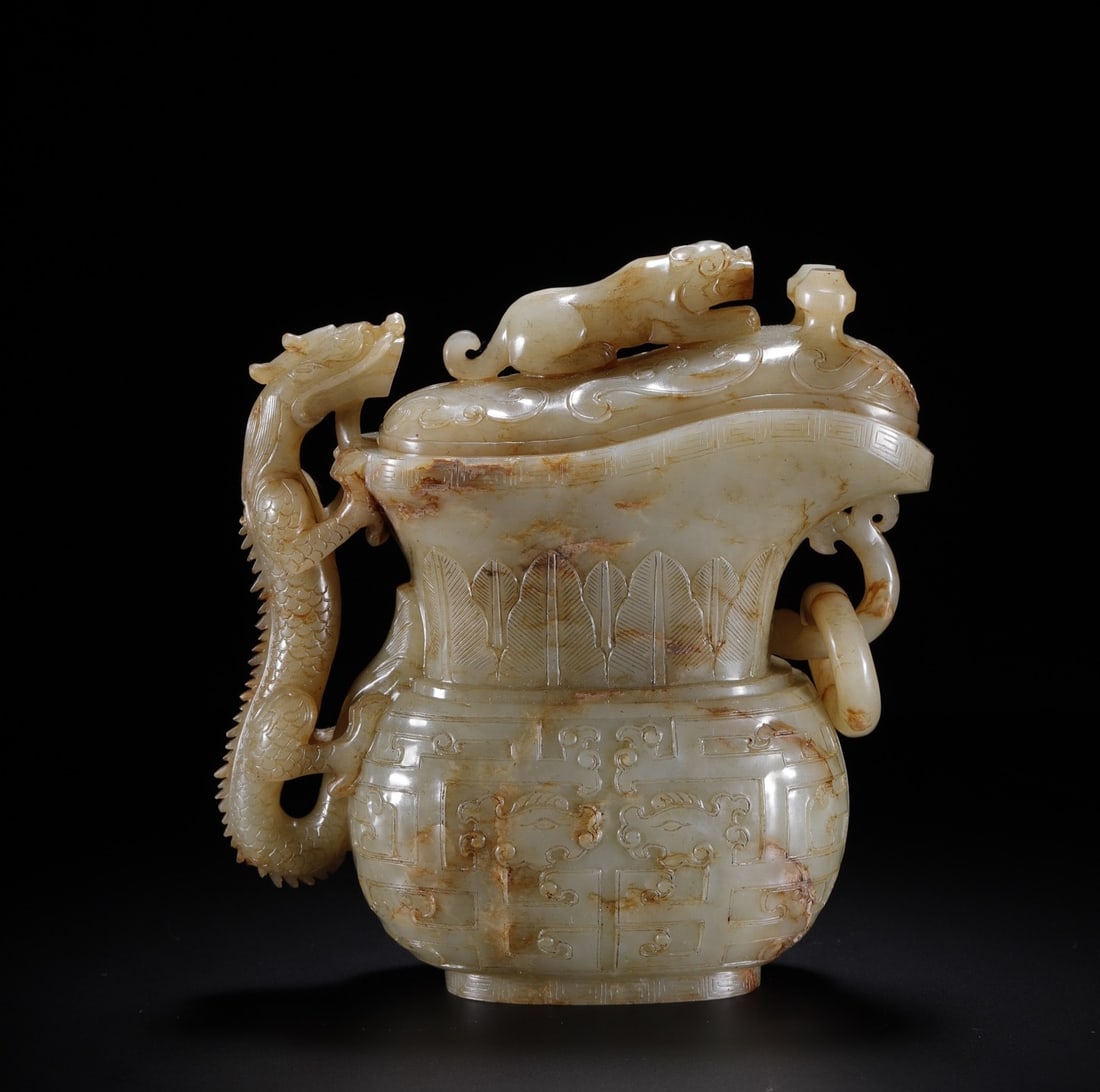 An Exquisite White Jade Dragon Pattern Ewer: An Exquisite White Jade Dragon Pattern Ewer Qing Dynasty, China Size:5.5inx5inx2.5in Weight:954g白玉龙纹觥 中国清代 Size:14cmx12.8cmx6.3cm Weight: