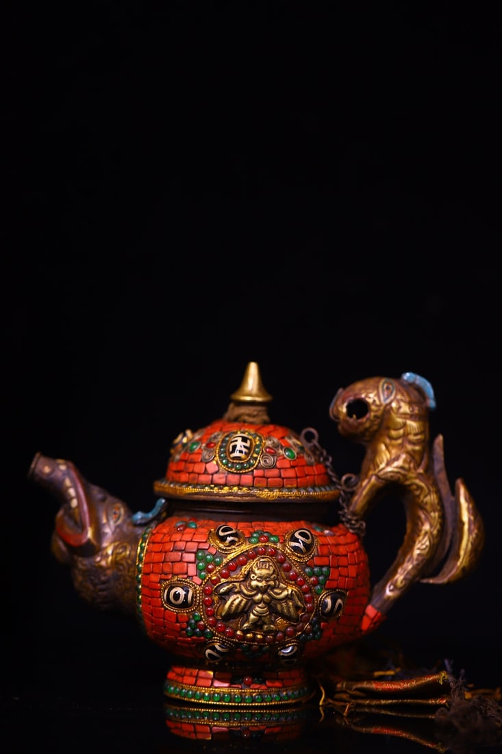 An Exquisite Bronze Inlaid Gems Teapot: An Exquisite Bronze Inlaid Gems Teapot Qing Dynasty, China Size:6.3inx7.9in Weight:700g铜镶嵌宝石天珠酥油壶 中国清代