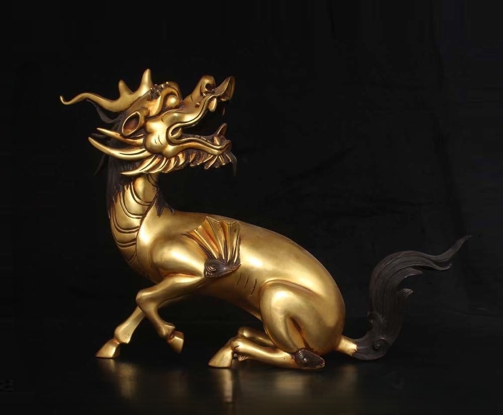 An Exquisite Gilt Bronze Kylin Ornament: An Exquisite Gilt Bronze Kylin Ornament Ming Dynasty, China Xuande Four-character Mark Size:12.6inx9.8in Weight:4310g铜鎏金麒麟摆件 中国明&#