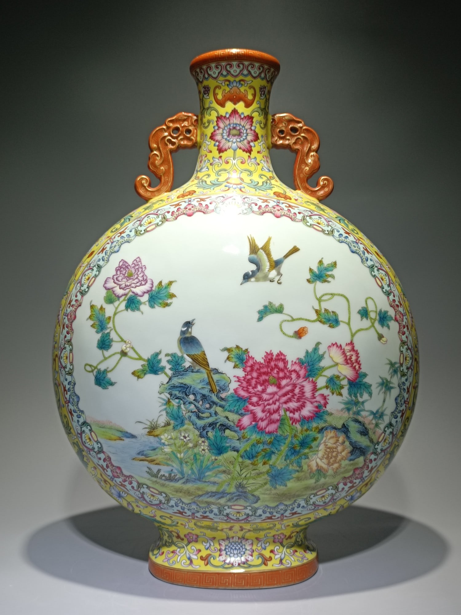 An Exquisite Famille-Rose Lotus Pattern Flower and Bird Pattern Double-Ears Vase: An Exquisite Famille-Rose Lotus Pattern Flower and Bird Pattern Double-Ears Vase Qing Dynasty, China Qianlong Six-character Mark Size:19.3inx13.8in粉彩黄地福运Ű
