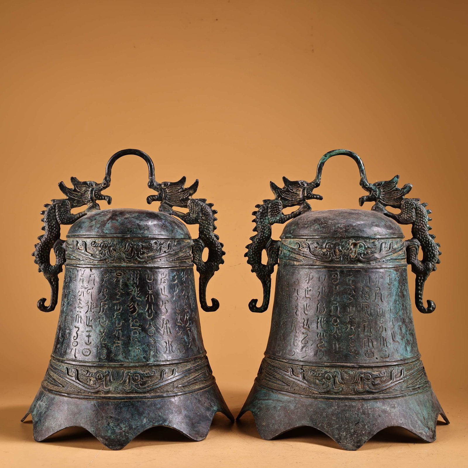 A Pair of Exquisite Bronze With Inscription Ornament: A Pair of Exquisite Bronze With Inscription Ornament Han Dynasty, China Size:10.6inx7.9in Weight:2400g青铜双龙耳铭文钟一对 中国&