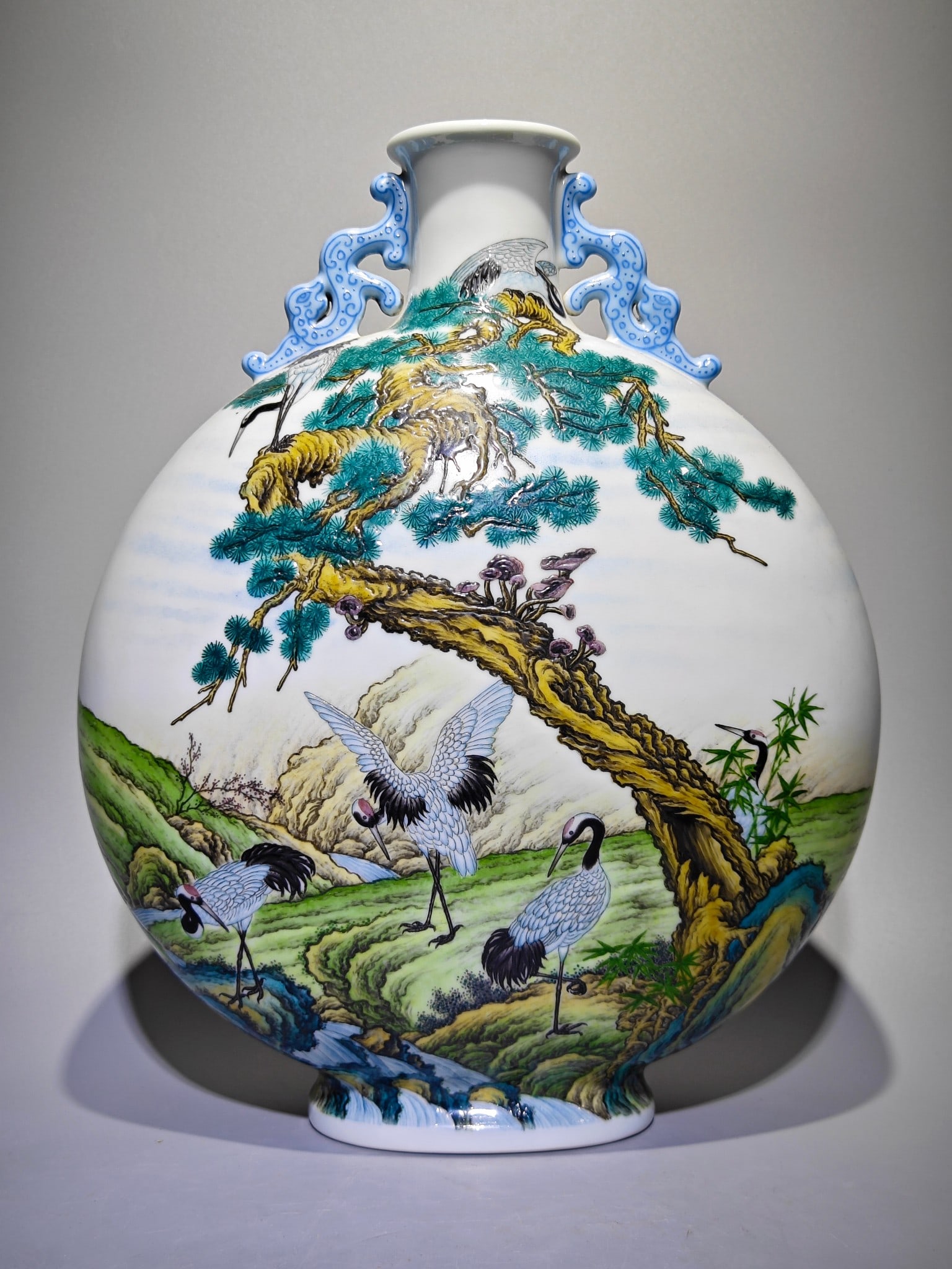 An Exquisite Enamel Pine and Crane Pattern with poem Double-Ears Vase: An Exquisite Enamel Pine and Crane Pattern with poem Double-Ears Vase Qing Dynasty, China Yongzheng Four-character Mark Size:12.6inx10.2in珐琅彩诗文六鹤ࡧ