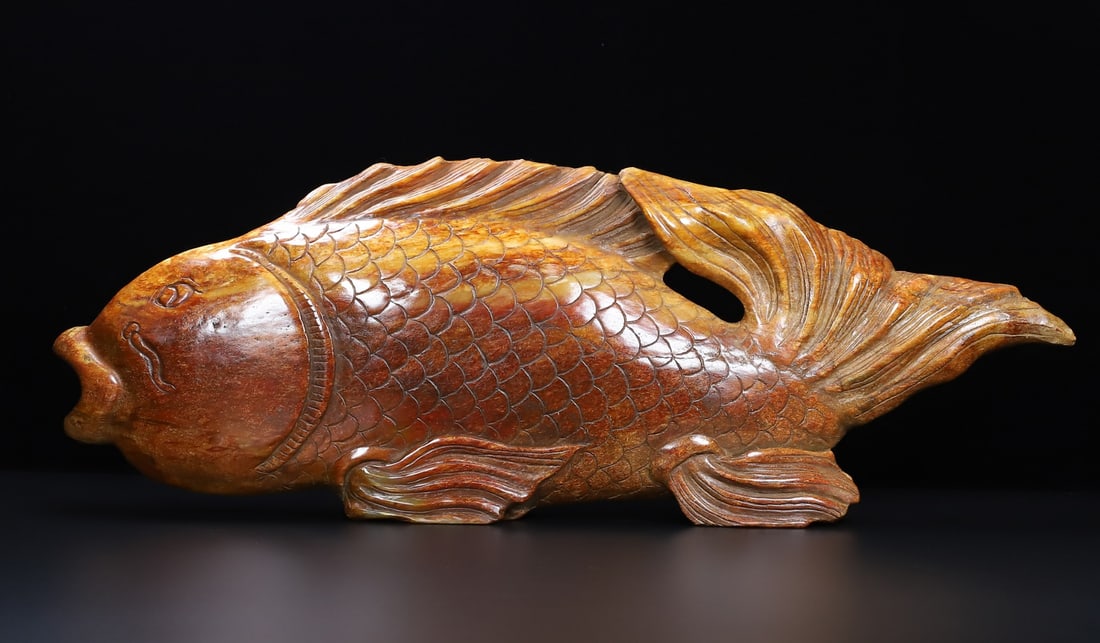 An Exquisite White Jade Fish Ornament: An Exquisite White Jade Fish Ornament Han Dynasty, China Size:22.4inx7.9inx2in Weight:8250g白玉鱼摆件 中国汉代 Size:57cmx20cmx5cm Weight:8250g