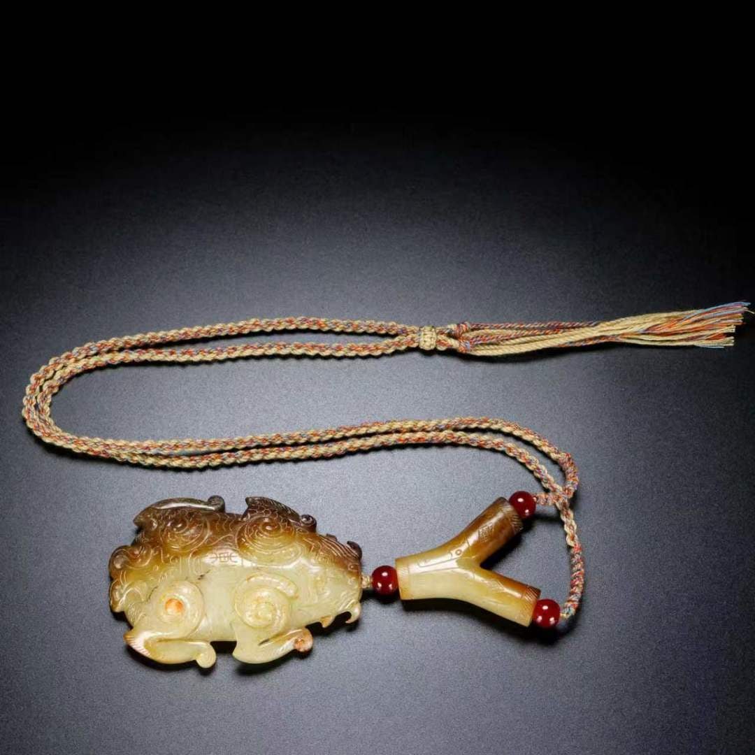 A Exquisite Hotan Jade Auspicious Beast Pendant: A Exquisite Hotan Jade Auspicious Beast Pendant,Han Dynasty, China,Size:5.1inx2.2inx0.6in ,Weight:104g 和田玉瑞兽挂坠,中国汉代
