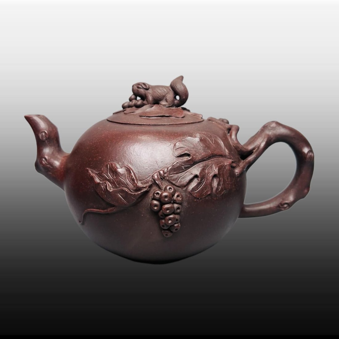 A Exquisite Purple Sands Squirrel and Grapes Pattern Teapot: A Exquisite Purple Sands Squirrel and Grapes Pattern Teapot,Republic of China,With Mark,Size:4.7inx5.9in 紫砂松鼠葡萄纹壶,民国,带Ē