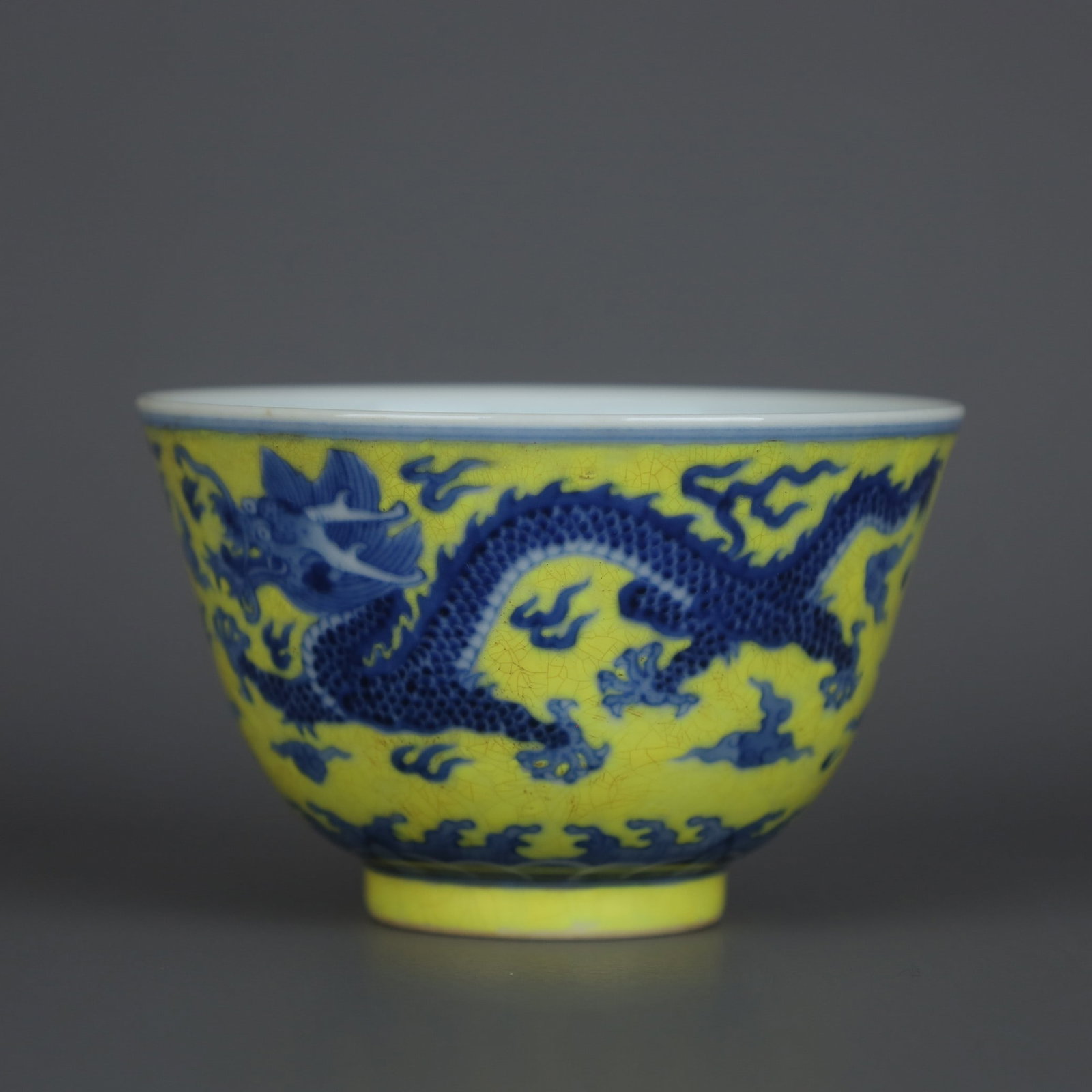 A Exquisite Yellow Glazed Blue and White Dragon Pattern Cup: A Exquisite Yellow Glazed Blue and White Dragon Pattern Cup,Qing Dynasty, China,Qianlong Six-character Mark,Size:2.2inx3.5in 黄釉青花龙纹杯,中国&#