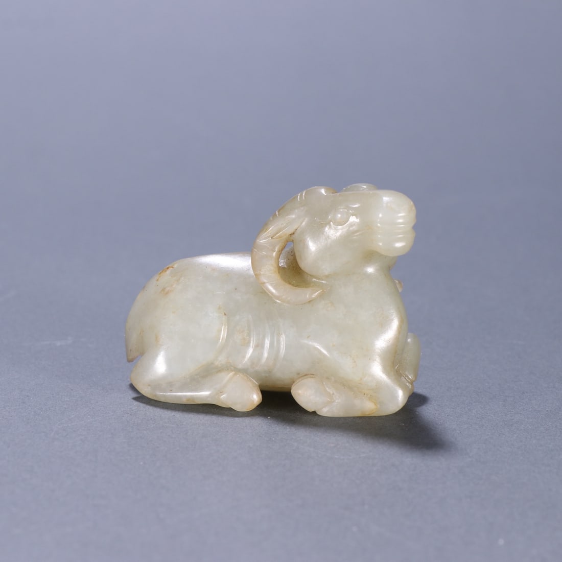 A Exquisite Hotan Jade Sheep Ornament: A Exquisite Hotan Jade Sheep Ornament,Ming Dynasty, China,Size:2inx1.5in,Weight:67.2g 和田玉羊摆件,中国明代