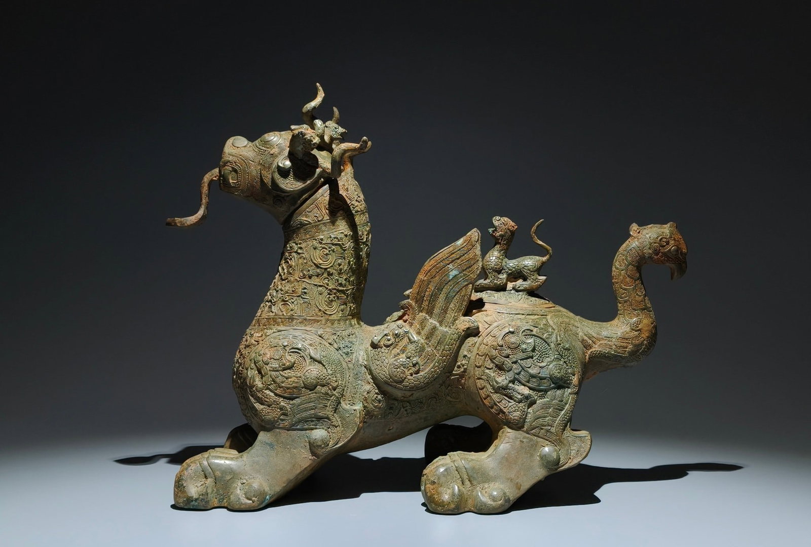A Exquisite Bronze Dragon Pattern Auspicious Beast Ornament: A Exquisite Bronze Dragon Pattern Auspicious Beast Ornament,Ancient Time, China,Size:11.8inx16.9inx8.7in 青铜龙纹瑞兽摆件,远古时੏