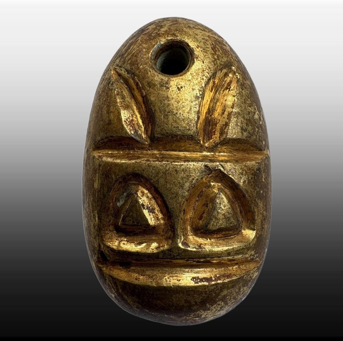 A Exquisite Gilt Bronze Coin: A Exquisite Gilt Bronze Coin,Han Dynasty, China,Size:1.3inx0.8in,Weight:30g 铜鎏金鬼脸金钱,中国汉代