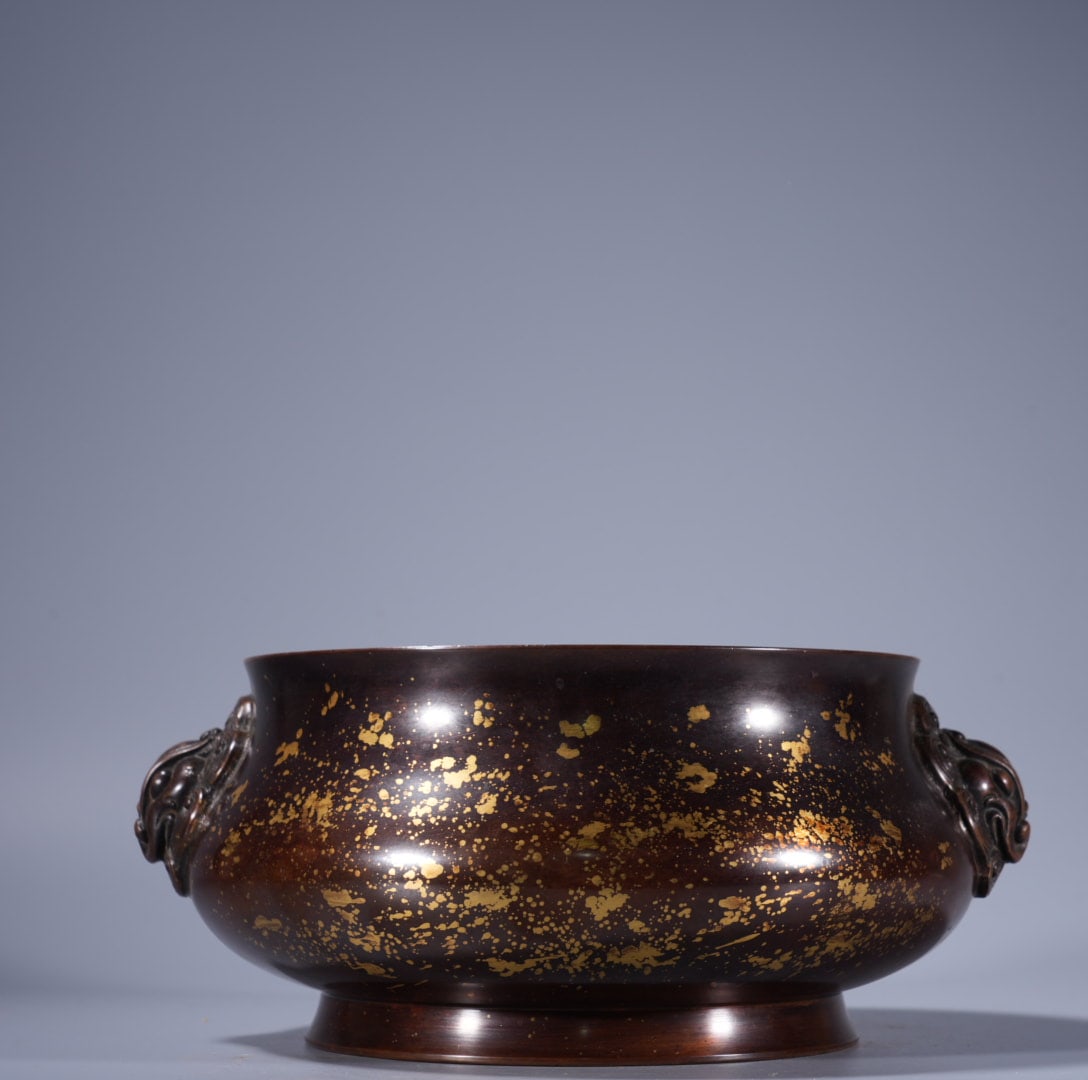A Exquisite Copper Gold-Splashed Lion-Ears Censer: A Exquisite Copper Gold-Splashed Lion-Ears Censer,Ming Dynasty, China,With Mark,Size:3.8inx6.5in,Weight:3535g 紫铜洒金狮耳炉,中国明代,