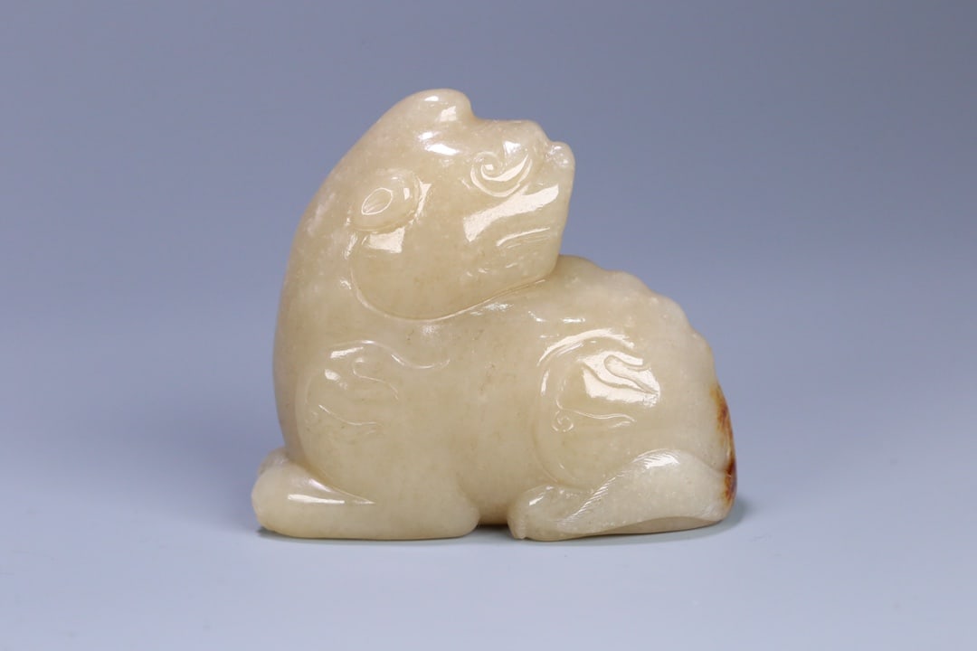 A Exquisite Hotan Jade Auspicious Beast Ornament: A Exquisite Hotan Jade Auspicious Beast Ornament,Qing Dynasty, China,Size:2.7inx3inx1.5in,Weight:263g 和田玉瑞兽摆件,中国清代