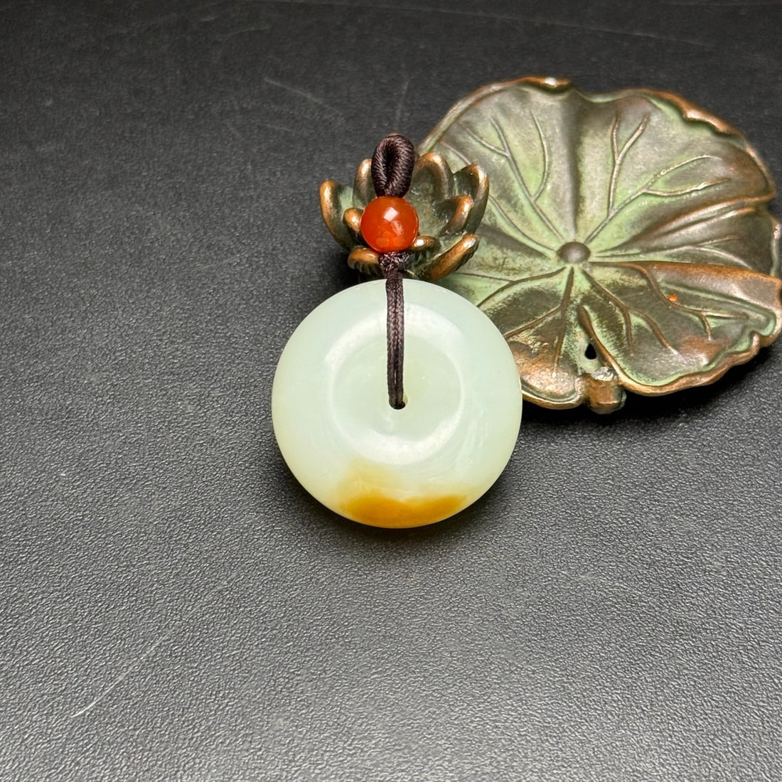 A Exquisite Hotan Jade Pendant: A Exquisite Hotan Jade Pendant,Qing Dynasty, China,Size:1.1inx0.5in, Weight:16g 和田玉吊坠,中国清代