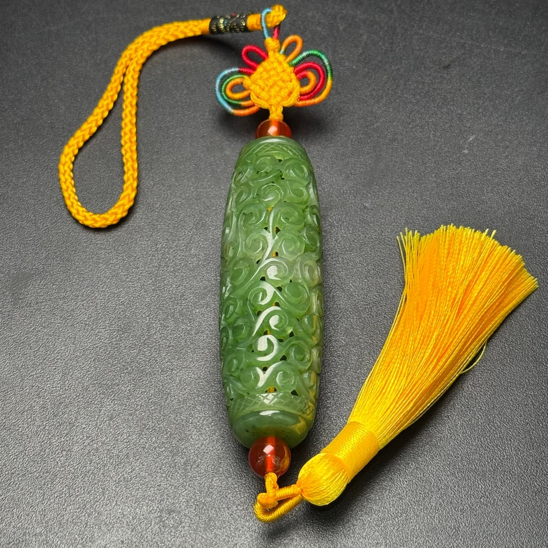 A Exquisite Hotan Jasper Interlocking Branch Pattern Pendant: A Exquisite Hotan Jasper Interlocking Branch Pattern Pendant,Qing Dynasty, China,Size:0.8inx2.7in, Weight:31g 和田碧玉缠枝纹挂件,中国&