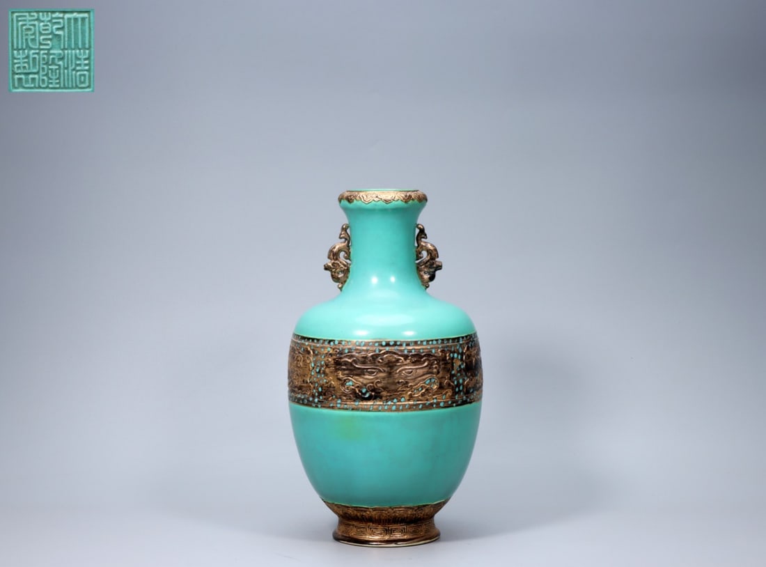 A Exquisite Turquoise-Glazed Dragon Pattern Double-Ears Vase: A Exquisite Turquoise-Glazed Dragon Pattern Double-Ears Vase,Qing Dynasty, China,Qianlong Six-character Mark,Size:13inx2.8inx7.1inx4.1in,Weight:1753g 松石绿釉龙纹&#