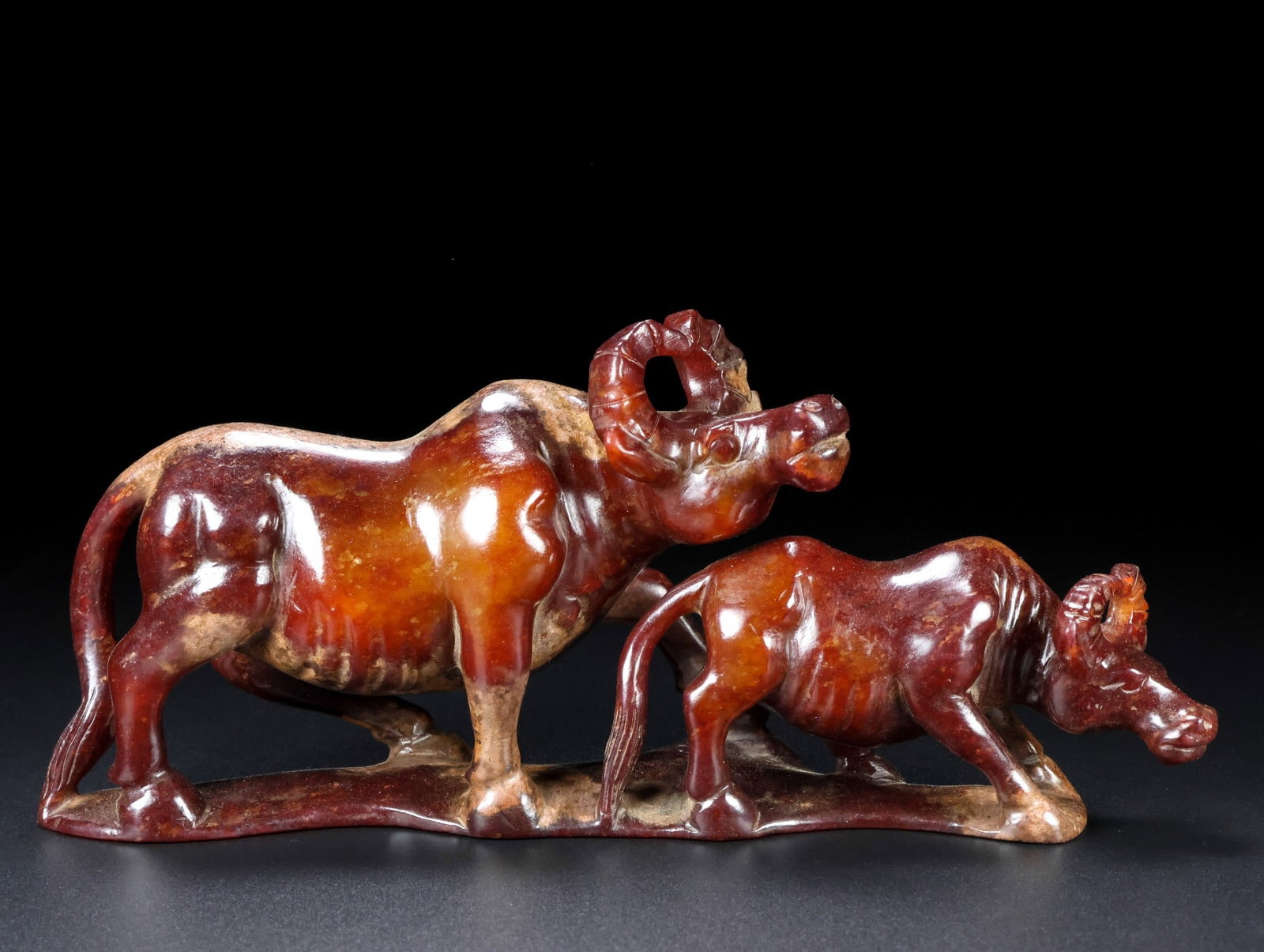 A Exquisite Hotan Jade Buffalo Ornament: A Exquisite Hotan Jade Buffalo Ornament,Han Dynasty, China,Size:9.1inx3.9inx2.4in ,Weight:823g 和田玉牛摆件,中国汉代