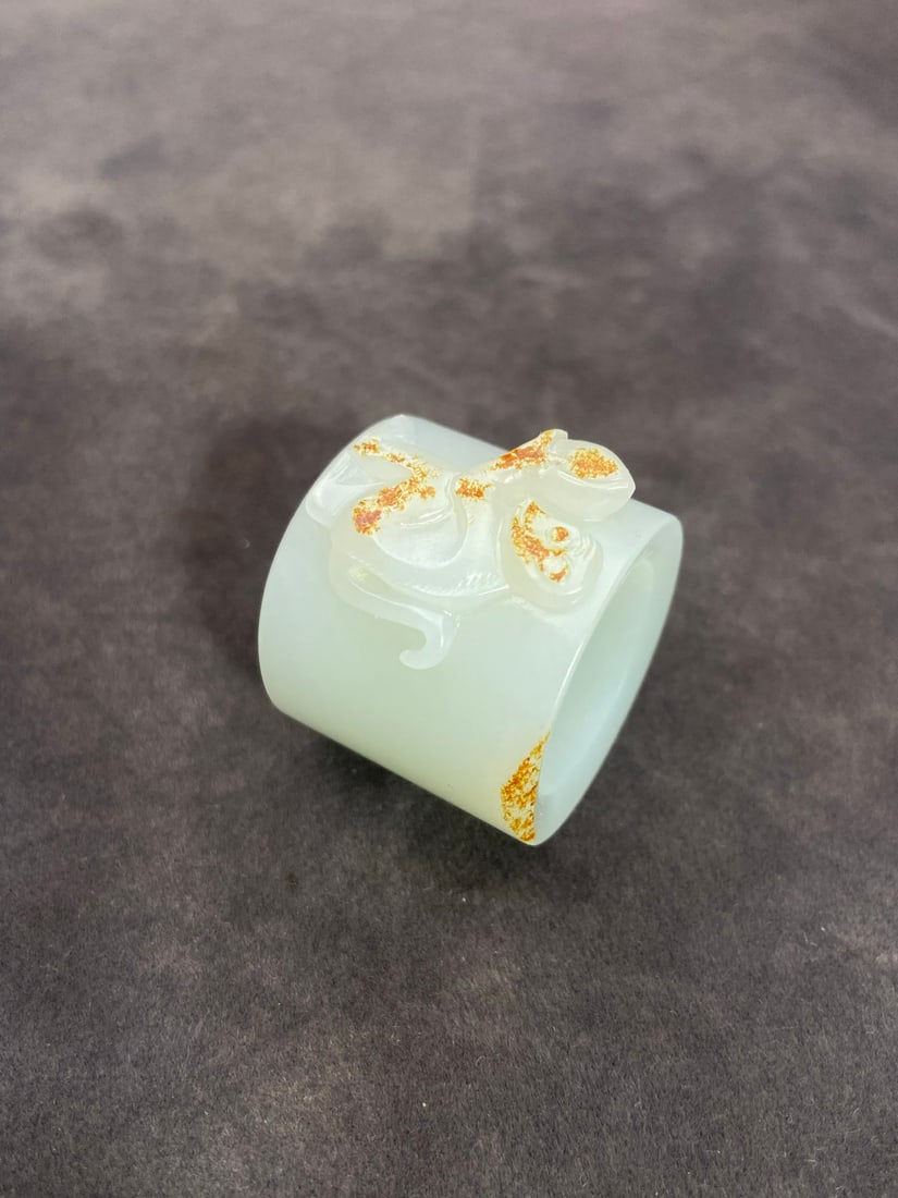 A Exquisite Hotan Jade Monkey Pattern Thumb Ring: A Exquisite Hotan Jade Monkey Pattern Thumb Ring,Ming Dynasty, China,Size:1.1inx0.9in ,Weight:32g 和田玉猴纹扳指,中国明代