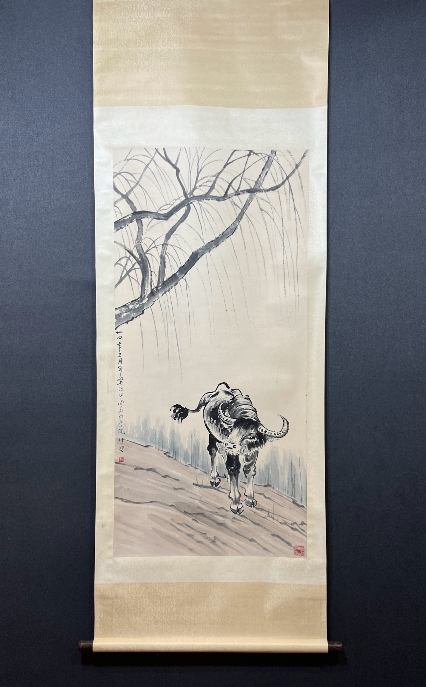 A Chinese Vertical Scroll Ink Painting of Buffalo on Paper: A Chinese Vertical Scroll Ink Painting of Buffalo on Paper,Modern Time of China,Xu Beihong,without frame size:27.2inx53.9in 一幅中国水墨纸本牛