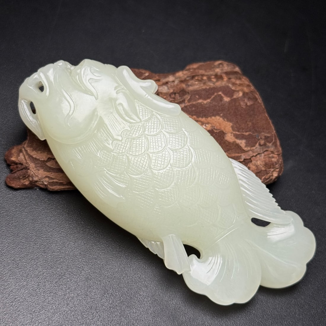 A Exquisite Hotan Jade Fish Handheld Carving: A Exquisite Hotan Jade Fish Handheld Carving,Qing Dynasty, China,Size:4.3inx1.7inx0.9in ,Weight:138g 和田玉鱼手把件,中国清代