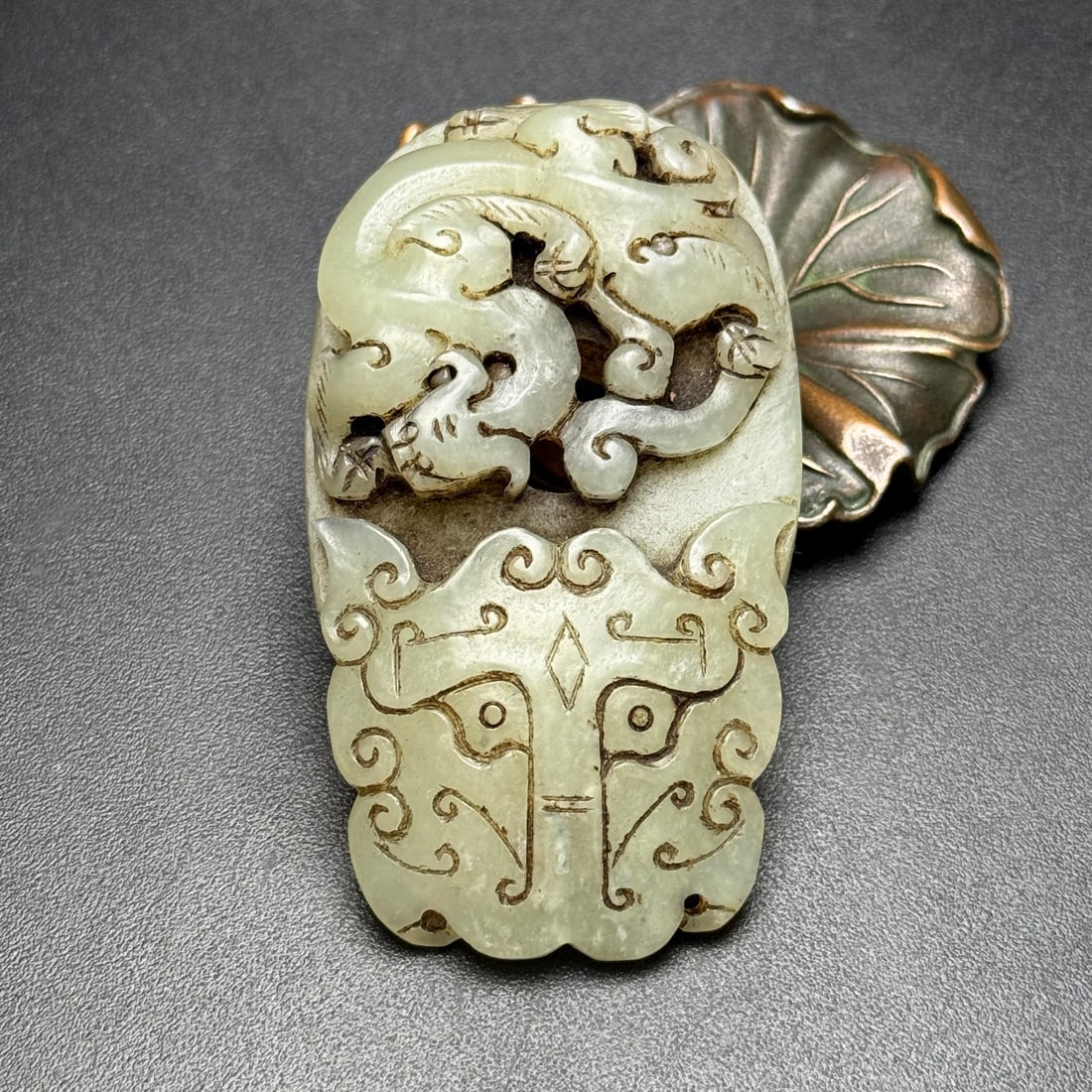A Exquisite Hotan White Jade Dragon Beast-Face Pattern Pendant: A Exquisite Hotan White Jade Dragon Beast-Face Pattern Pendant,Han Dynasty, China,Size:2.8inx1.6inx0.6in, Weight:71g 和田白玉龙兽面纹佩,中&#